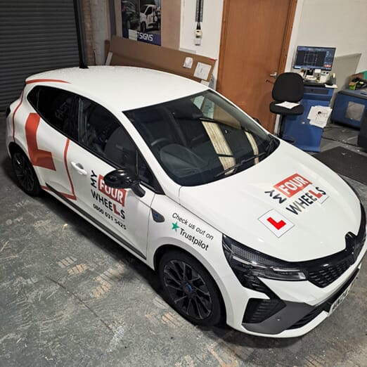 An image of the My Four Wheels car before FASTSIGNS signage.